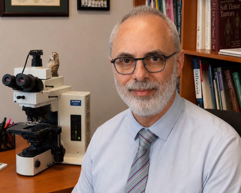 Dr. Fouad Boulos at his microscope